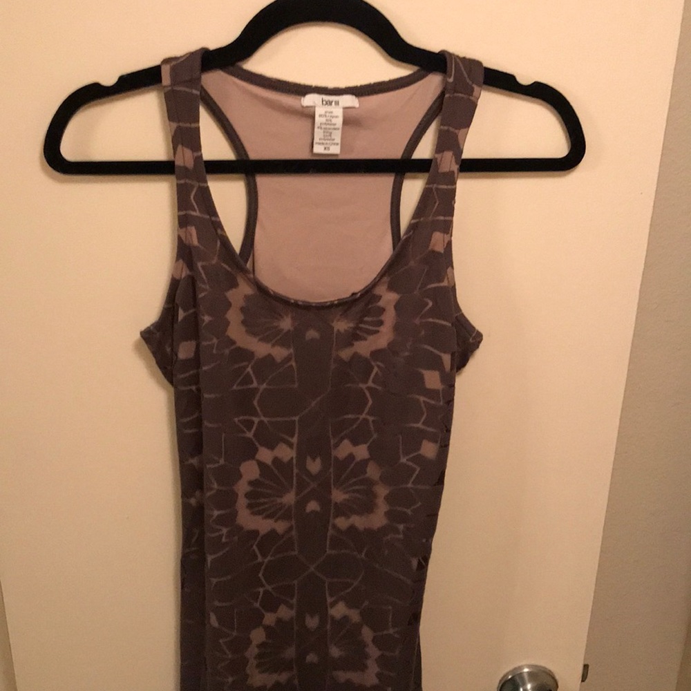 Sleeveless, floor length dress.